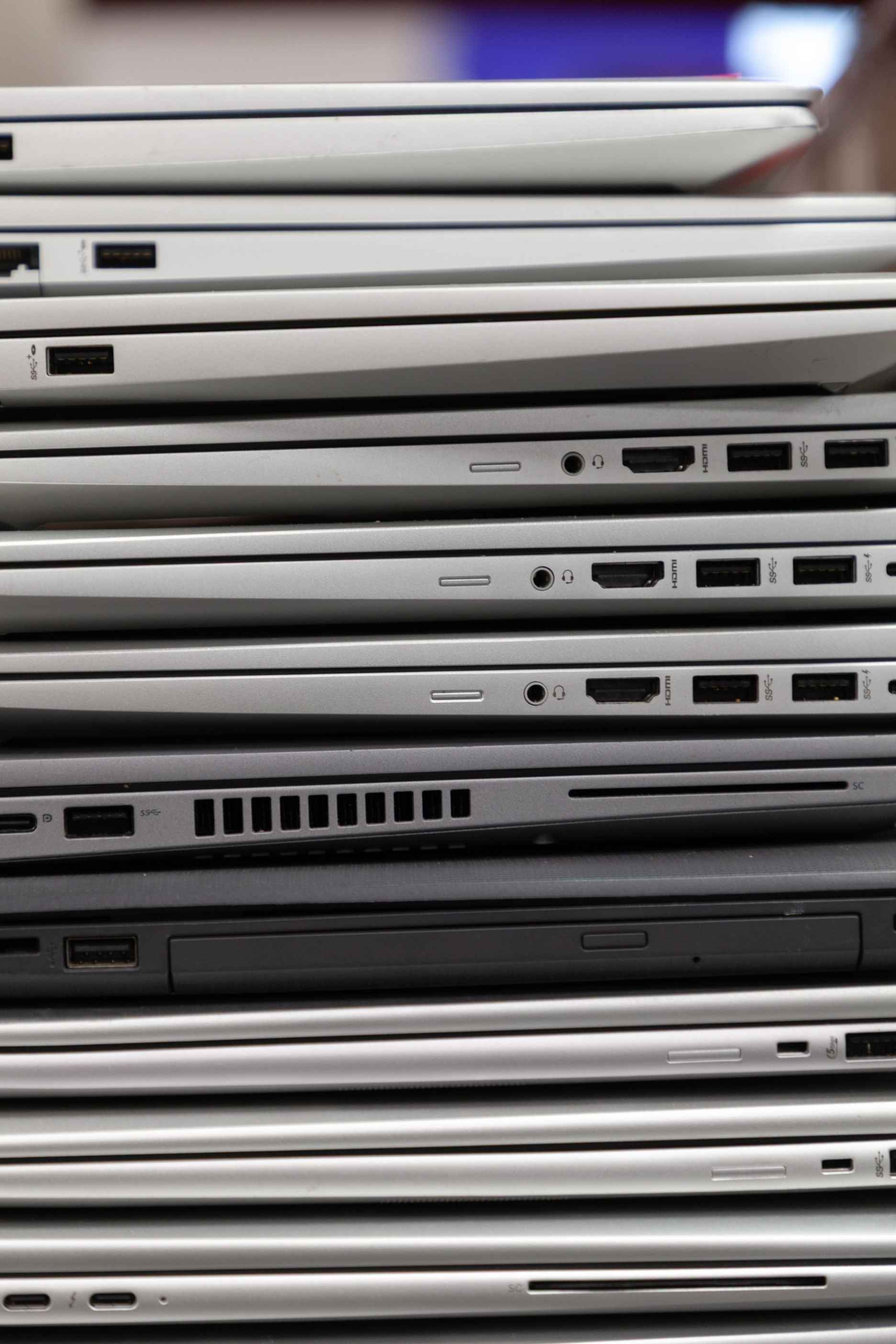 A stack of laptops ready for deployment