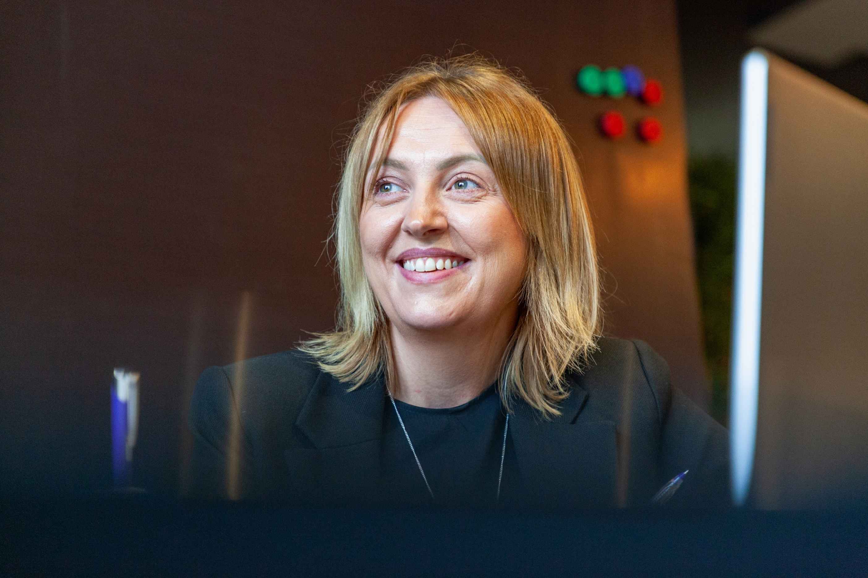 A smiling TSG team member in the office